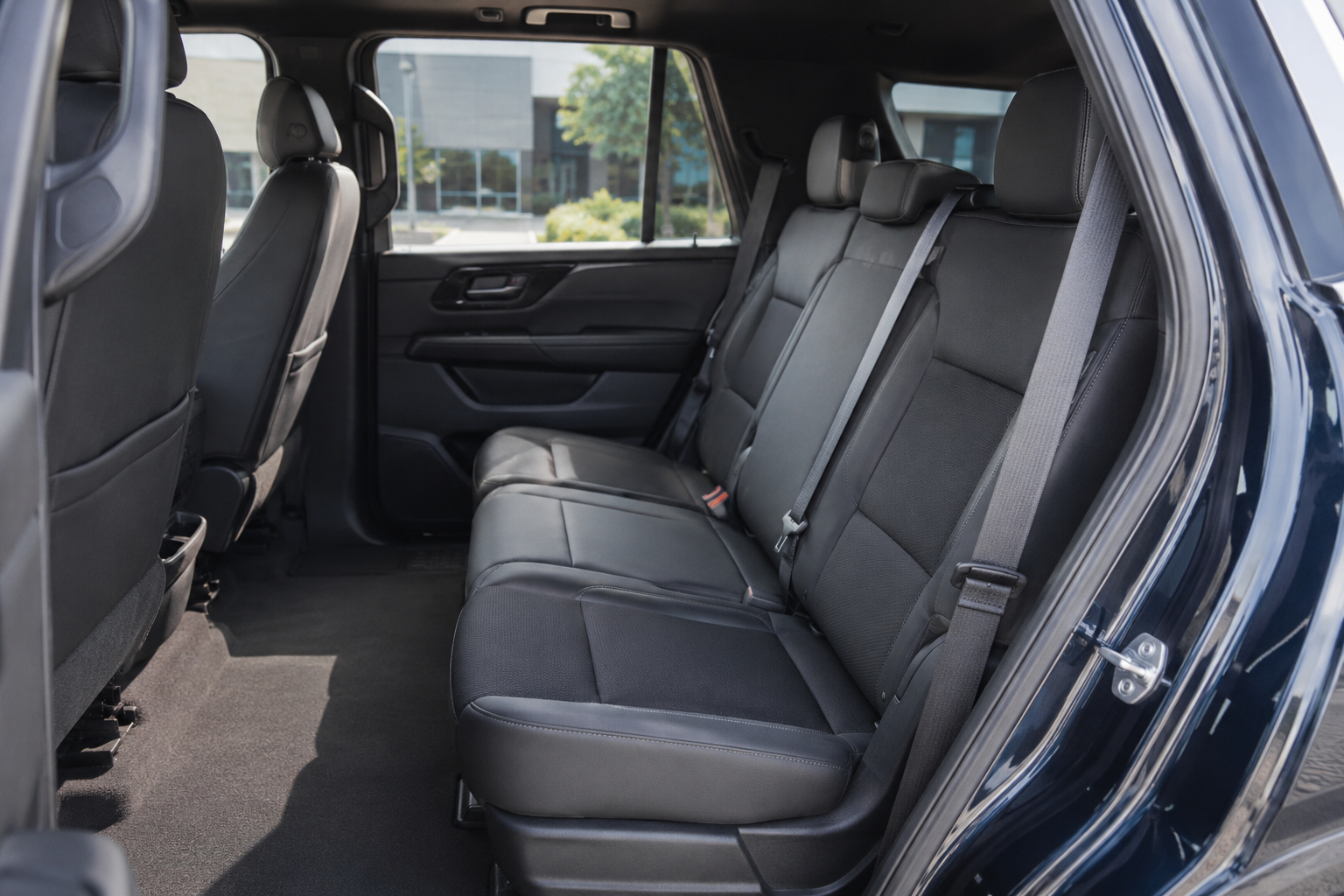 Clean and comfortable rear passenger compartment with seatbelts